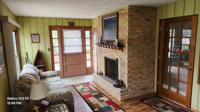 755 Brickley Dr, Fontana, WI 53125 - living room featuring light wood-style floors and a fireplace