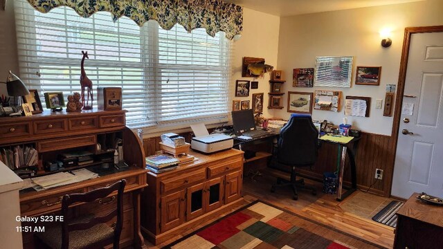 755 Brickley Dr, Fontana, WI 53125 - office featuring light wood finished floors, wood walls, plenty of natural light, and a wainscoted wall