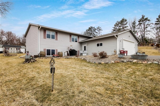 1229 W Beltline Rd, Spring Valley, WI 54767 - back of house featuring a garage and a lawn