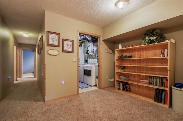 1229 W Beltline Rd, Spring Valley, WI 54767 - corridor featuring carpet floors, baseboards, a textured ceiling, and washer and clothes dryer