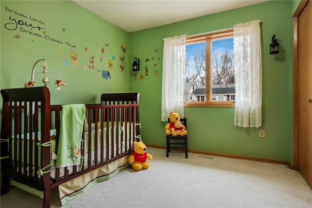1229 W Beltline Rd, Spring Valley, WI 54767 - carpeted bedroom with visible vents, baseboards, and a crib