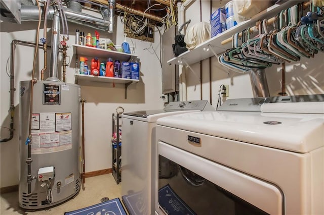 1229 W Beltline Rd, Spring Valley, WI 54767 - clothes washing area featuring water heater, washing machine and dryer, and baseboards