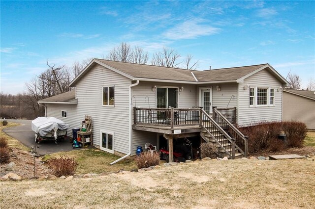 1229 W Beltline Rd, Spring Valley, WI 54767 - rear view of house with a wooden deck and stairway