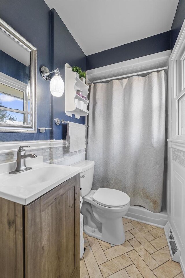 311 Blue View Dr, Mount Horeb, WI 53572 - full bathroom with vanity, curtained shower, visible vents, and toilet