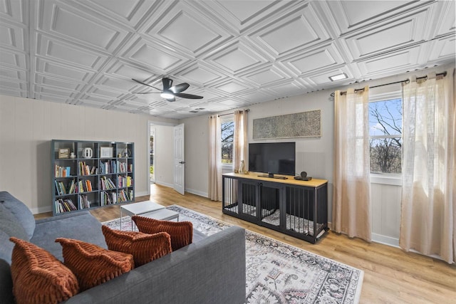 311 Blue View Dr, Mount Horeb, WI 53572 - living area with an ornate ceiling, ceiling fan, light wood finished floors, and baseboards