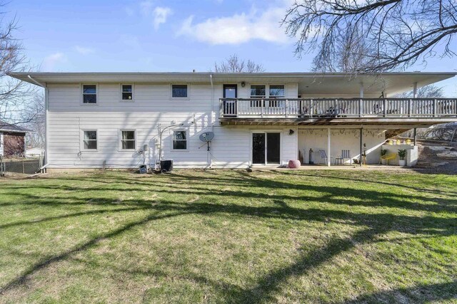 311 Blue View Dr, Mount Horeb, WI 53572 - back of house with central AC, a wooden deck, and a lawn