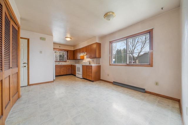 6671 Lasley Shore Dr, Winneconne, WI 54986 - kitchen featuring baseboard heating, light countertops, white electric range, brown cabinetry, and light floors