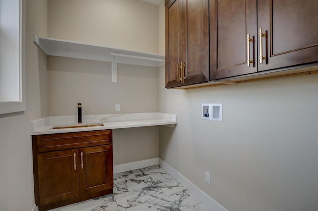 2025 Mulberry St, Sauk City, WI 53583 - clothes washing area featuring hookup for a washing machine, marble finish floor, a sink, baseboards, and cabinet space