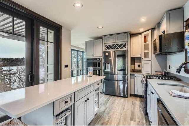 1020 Lake St, Prescott, WI 54021 - kitchen with gray cabinetry, light countertops, and appliances with stainless steel finishes