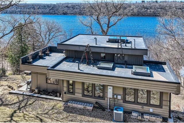 1020 Lake St, Prescott, WI 54021 - exterior space featuring cooling unit, a hot tub, and a water view