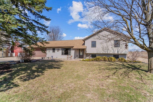 4208 County Road Z, Oshkosh, WI 54904 - back of house with a garage, a lawn, and concrete driveway