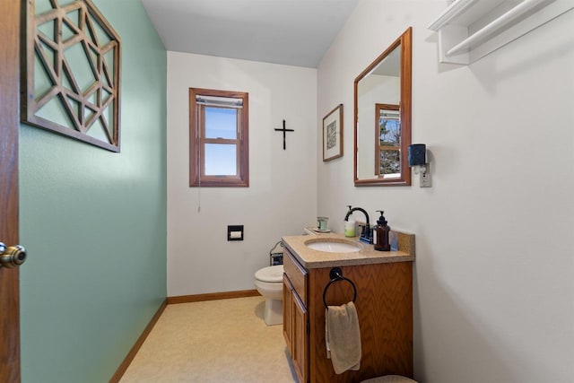 4208 County Road Z, Oshkosh, WI 54904 - half bathroom with toilet, baseboards, and vanity