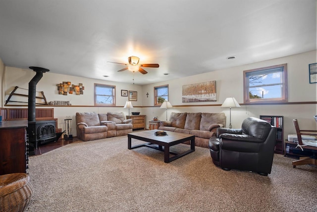 4208 County Road Z, Oshkosh, WI 54904 - living area featuring a wood stove and a ceiling fan