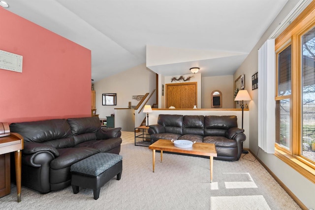 4208 County Road Z, Oshkosh, WI 54904 - carpeted living room featuring baseboards, plenty of natural light, and lofted ceiling
