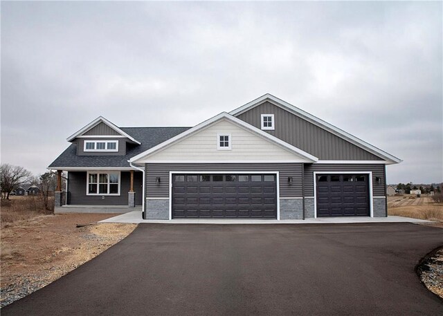 17297 109th Ave, Chippewa Falls, WI 54729 - craftsman house with driveway and a garage