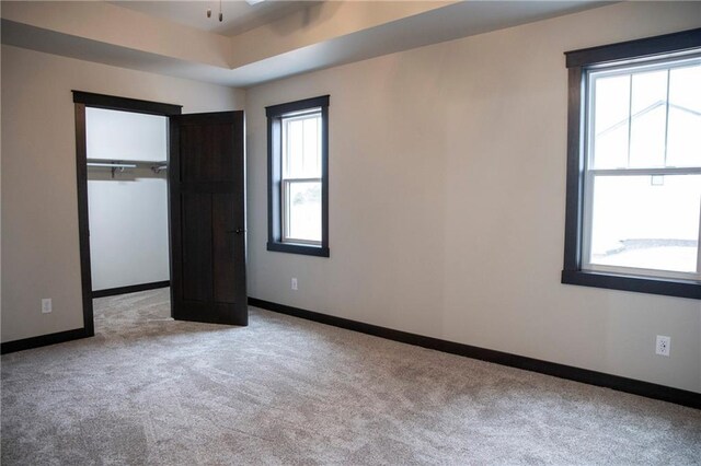 17297 109th Ave, Chippewa Falls, WI 54729 - unfurnished bedroom with carpet flooring, baseboards, and multiple windows
