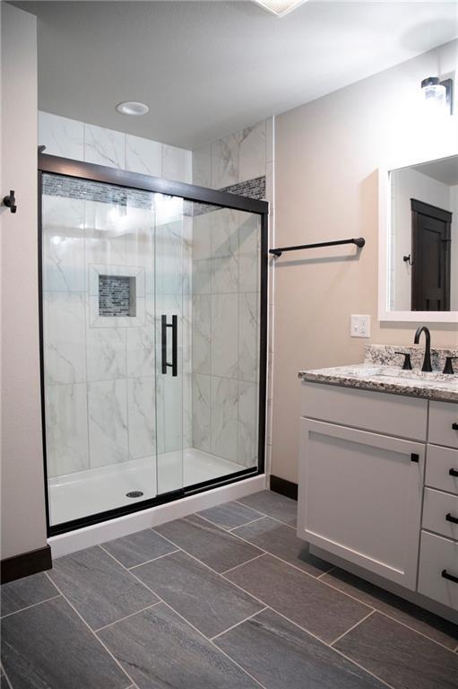 17297 109th Ave, Chippewa Falls, WI 54729 - full bathroom with a shower stall and vanity