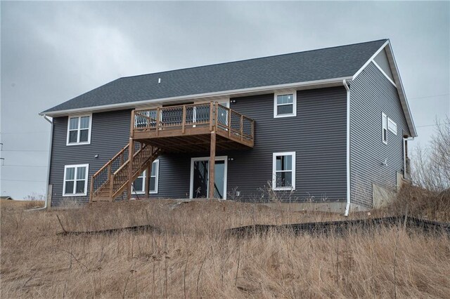 17297 109th Ave, Chippewa Falls, WI 54729 - rear view of property with a shingled roof, a wooden deck, and stairway