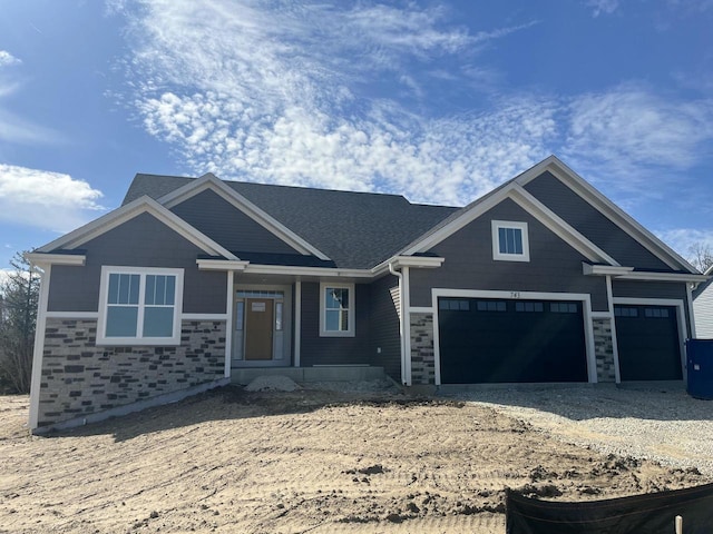 743 Brockway Dr Unit Lt37, Mukwonago, WI 53149 - view of front of property with an attached garage, stone siding, and gravel driveway