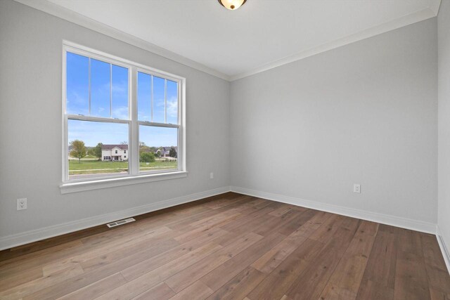 743 Brockway Dr Unit Lt37, Mukwonago, WI 53149 - spare room with wood-type flooring, baseboards, and crown molding