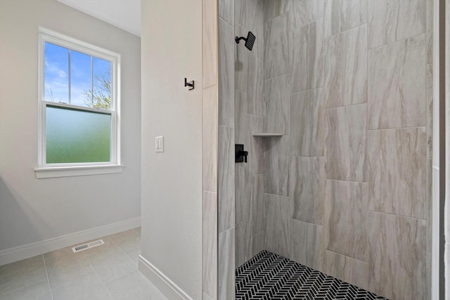 743 Brockway Dr Unit Lt37, Mukwonago, WI 53149 - bathroom with tiled shower, tile patterned floors, and baseboards