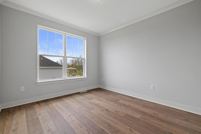 743 Brockway Dr Unit Lt37, Mukwonago, WI 53149 - unfurnished room with baseboards, hardwood / wood-style floors, and crown molding
