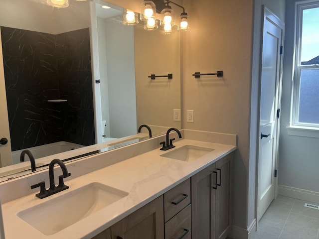 743 Brockway Dr Unit Lt37, Mukwonago, WI 53149 - bathroom featuring double vanity, tile patterned floors, and baseboards