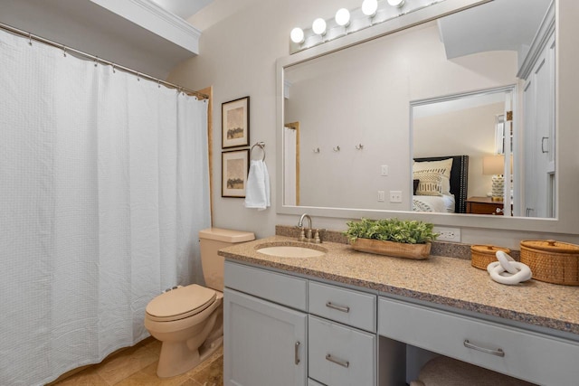 full bath featuring vanity and toilet