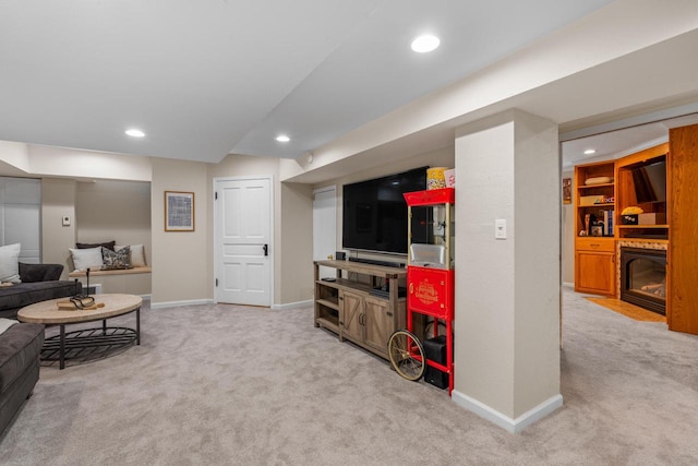 living area featuring carpet floors, recessed lighting, baseboards, and a fireplace with flush hearth