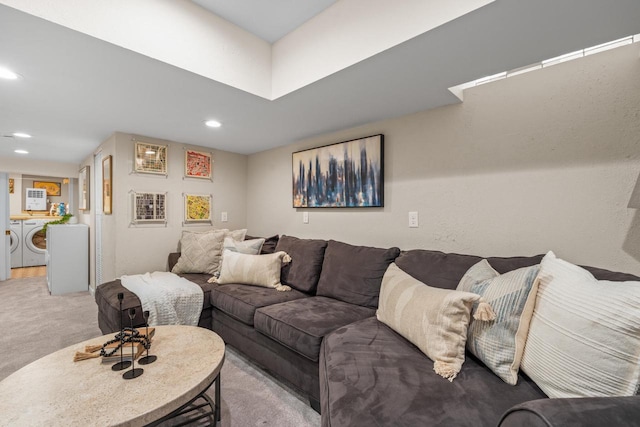 living area featuring carpet floors, recessed lighting, and washing machine and clothes dryer