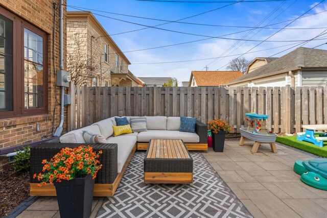view of patio featuring fence and outdoor lounge area