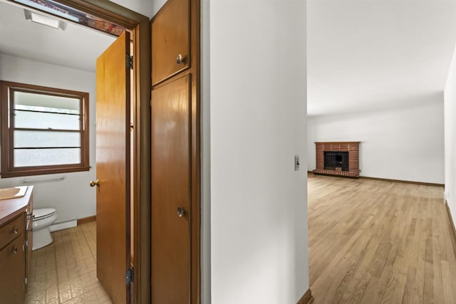 5221 Odana Rd, Madison, WI 53711 - hall featuring baseboards, a baseboard radiator, and light wood-style floors