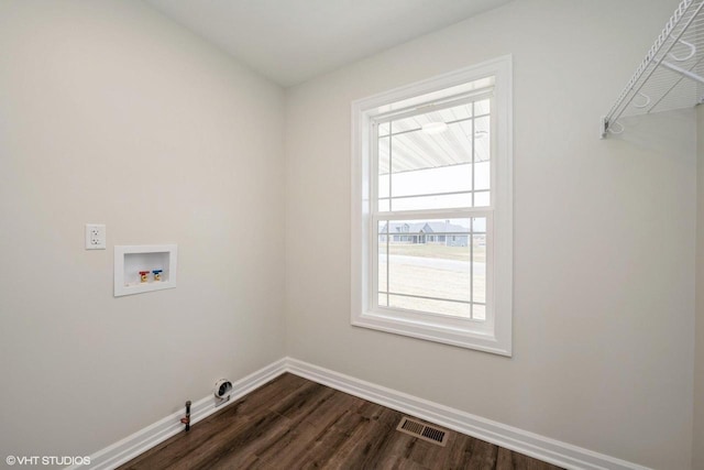 laundry area with baseboards, visible vents, laundry area, hookup for a washing machine, and dark wood finished floors