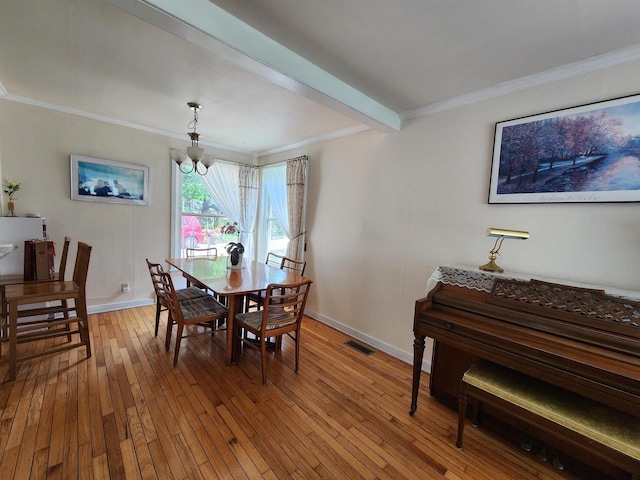 201 N Owen Dr, Madison, WI 53705 - dining room with a chandelier, crown molding, hardwood / wood-style flooring, beam ceiling, and baseboards