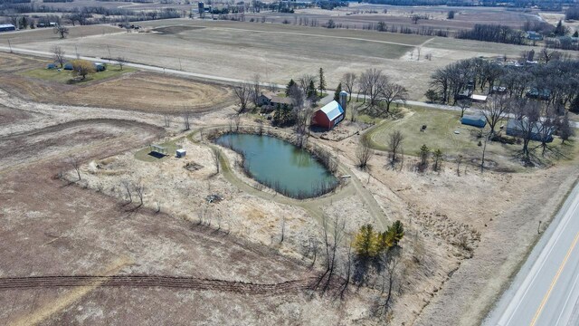 bird's eye view with a water view and a rural view
