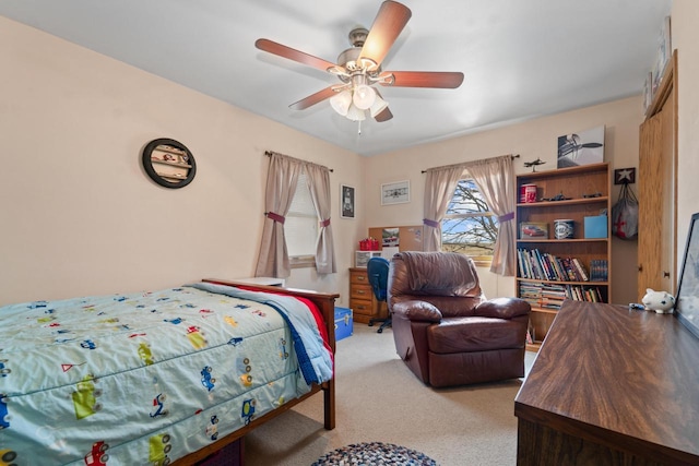 bedroom with ceiling fan and light carpet