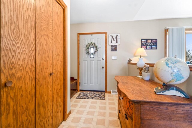 entryway with visible vents and light floors