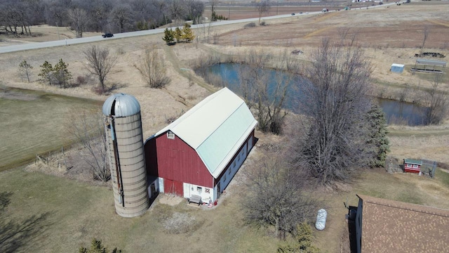 birds eye view of property with a rural view