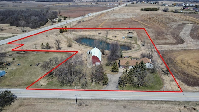 birds eye view of property featuring a rural view
