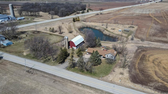 birds eye view of property featuring a rural view