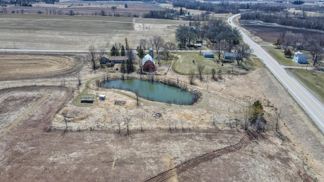 bird's eye view with a water view and a rural view
