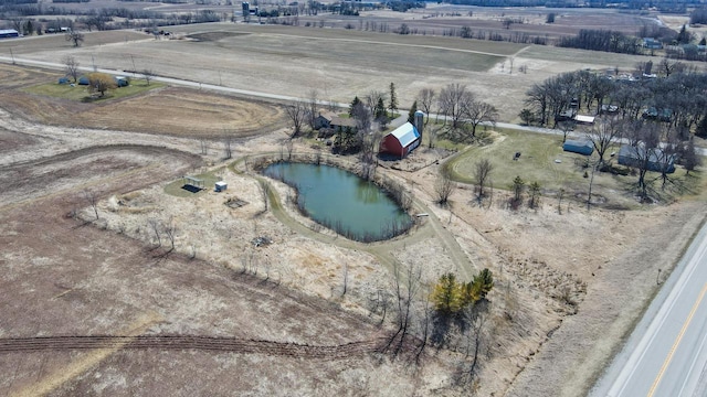 drone / aerial view with a water view and a rural view