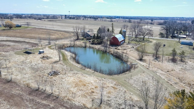 drone / aerial view featuring a water view and a rural view