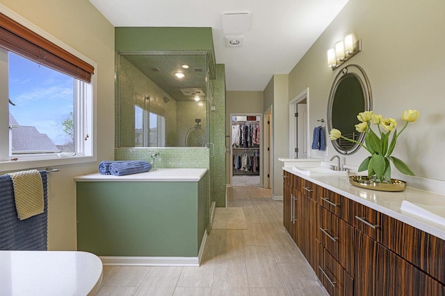 1105 Meadow Mist Rd, Middleton, WI 53562 - full bathroom featuring a stall shower, double vanity, a sink, and a spacious closet