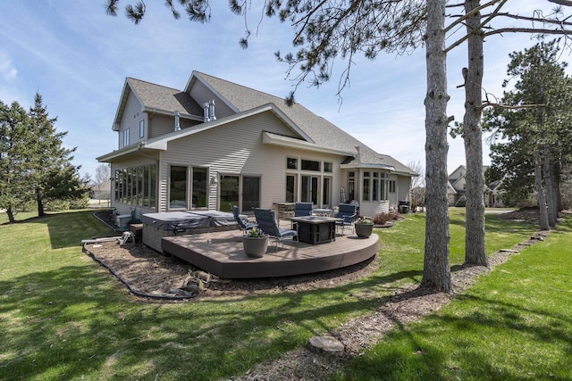 1105 Meadow Mist Rd, Middleton, WI 53562 - rear view of house featuring a deck, a hot tub, and a lawn
