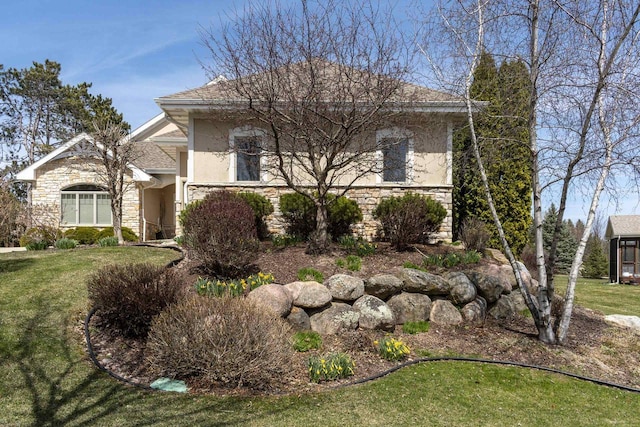 1105 Meadow Mist Rd, Middleton, WI 53562 - view of front of property with stucco siding, a front lawn, and stone siding