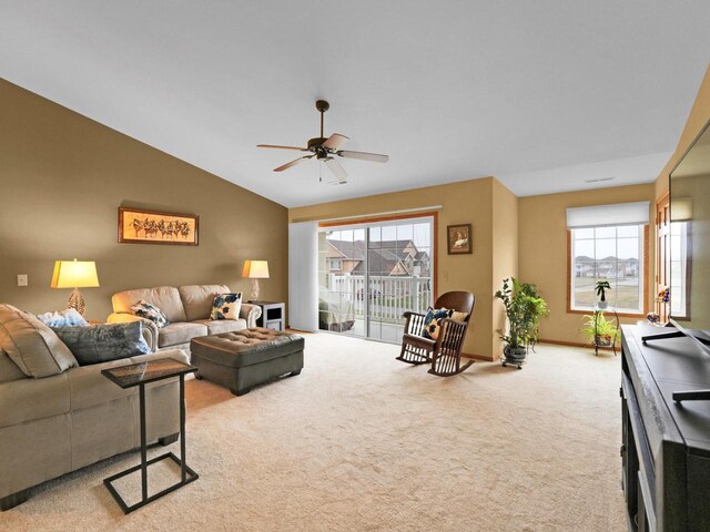 1734 Parkstone Ter Unit 73, Mount Pleasant, WI 53406 - living room with baseboards, a ceiling fan, carpet flooring, and vaulted ceiling