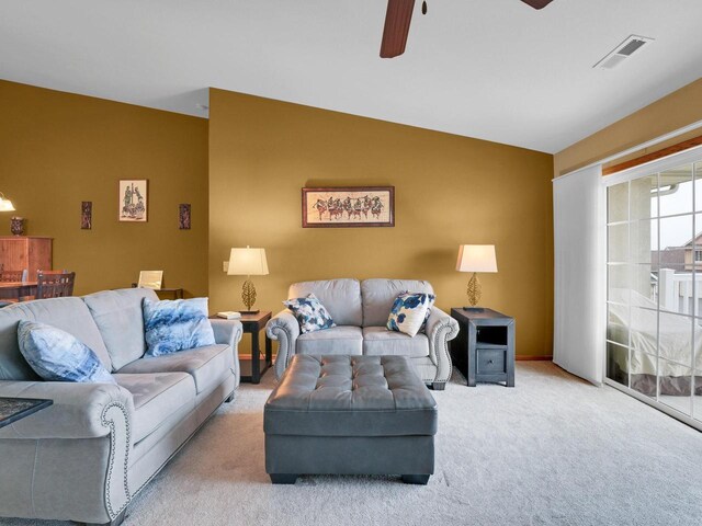 1734 Parkstone Ter Unit 73, Mount Pleasant, WI 53406 - living area featuring carpet, lofted ceiling, a ceiling fan, and visible vents