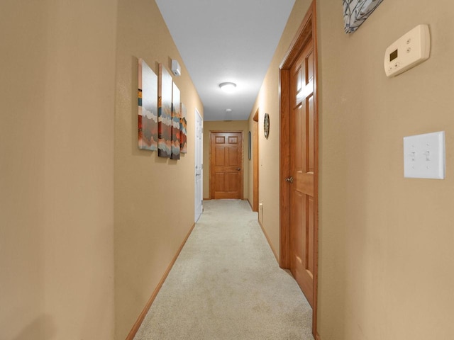 1734 Parkstone Ter Unit 73, Mount Pleasant, WI 53406 - corridor with light colored carpet and baseboards