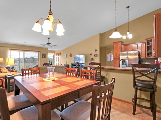 1734 Parkstone Ter Unit 73, Mount Pleasant, WI 53406 - dining room with light carpet, high vaulted ceiling, and ceiling fan with notable chandelier